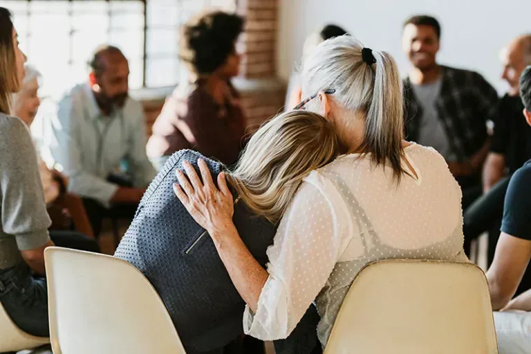 Residents in a local recovery support meeting