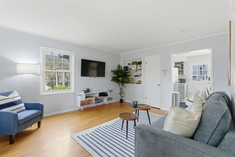 Living room in a Portland sober living home with an open view into the kitchen
