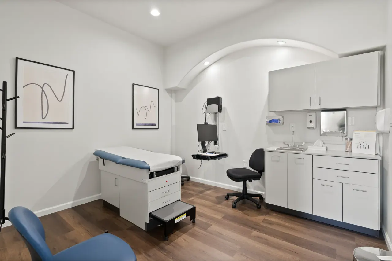 Medical exam room with blue examination table and clinical workstation at Discover Recovery medical detox in Camas, Washington