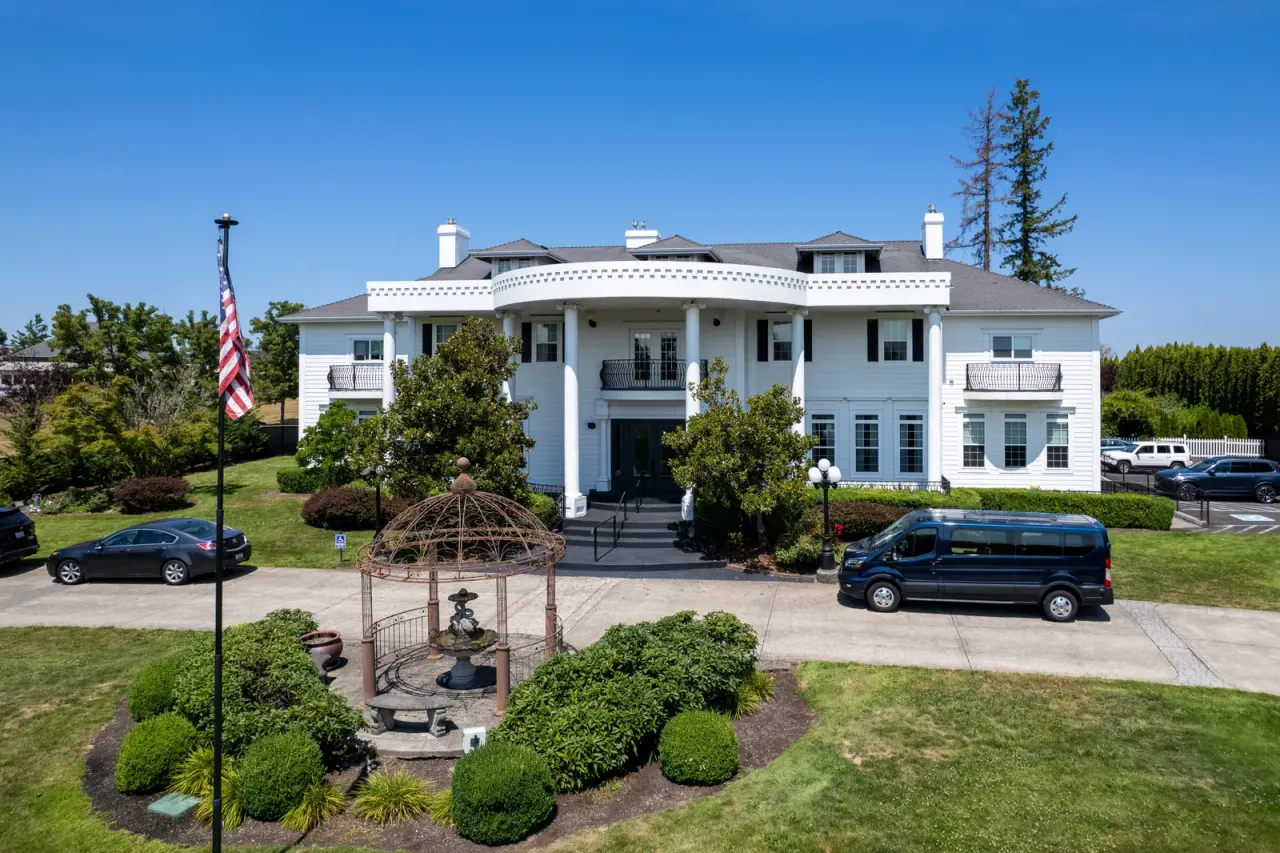 Front exterior of Discover Recovery campus in Camas, Washington with columned portico and circular driveway