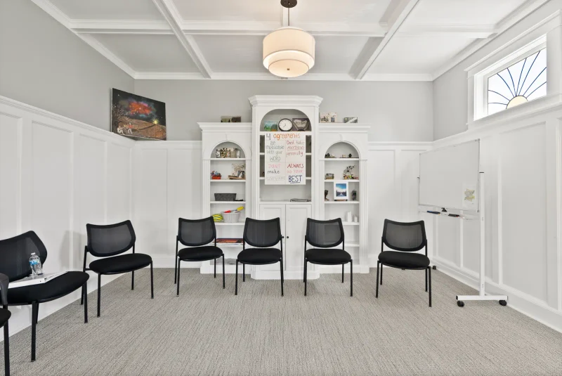 Meeting room with chairs and mobile whiteboard for veterans addiction treatment at Discover Recovery