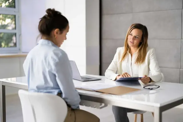 a provider and client talk about the benefits of intensive outpatient treatment
