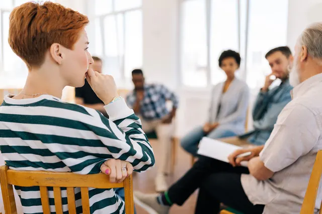 people in group therapy as part of trauma informed addiction treatment