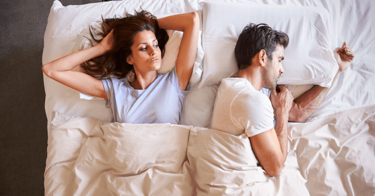 Overhead of couple in bed