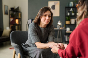 a therapist listens to a client during residential treatment