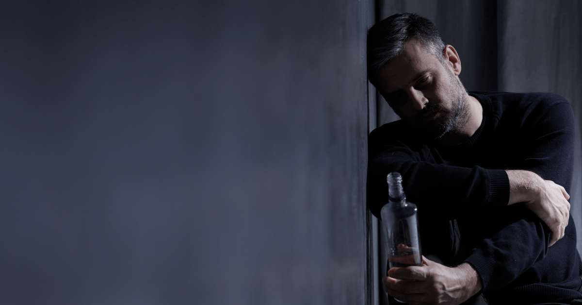 Man with bottle of alcohol
