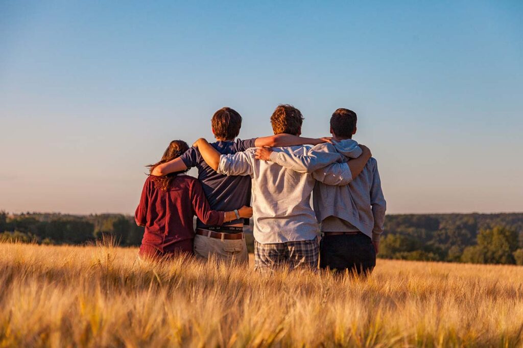 a group of people join arms