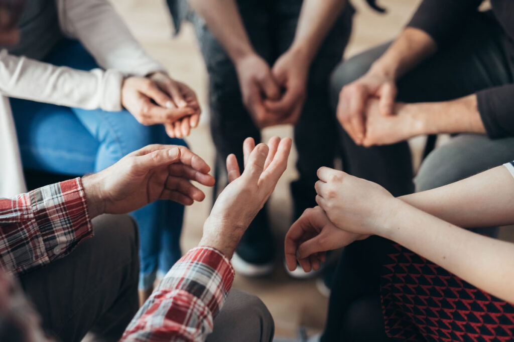 people in group therapy at one of many dual diagnosis treatment centers