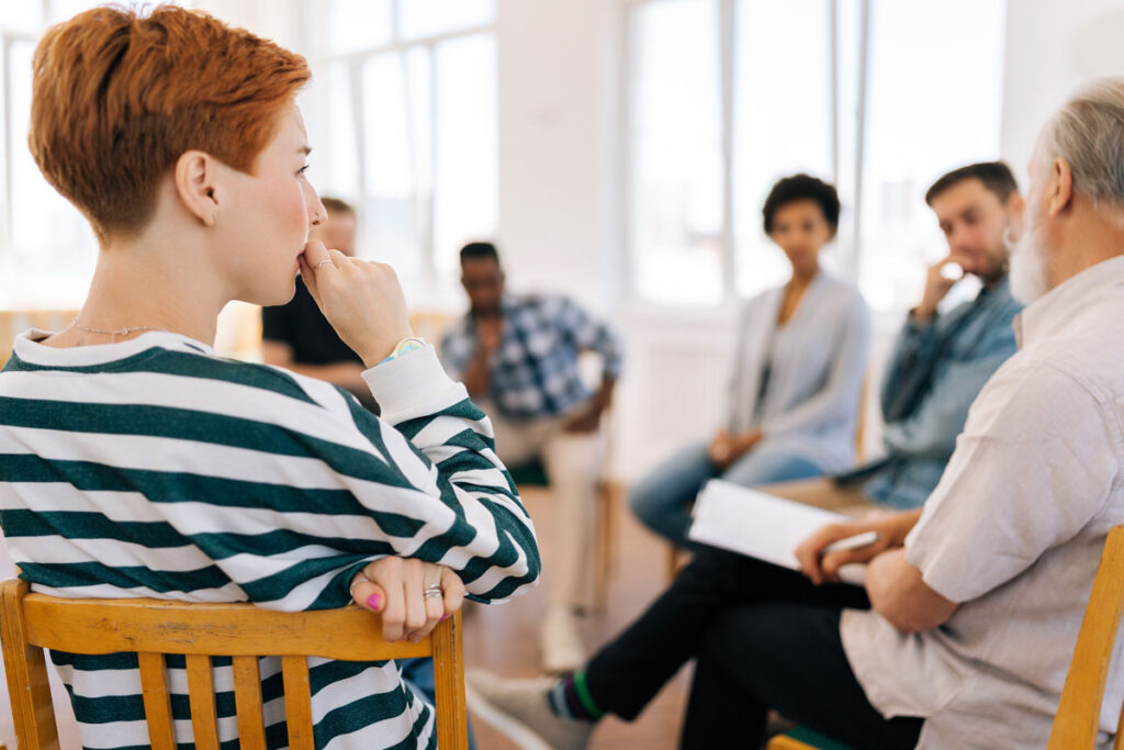 people in group therapy as part of trauma informed addiction treatment