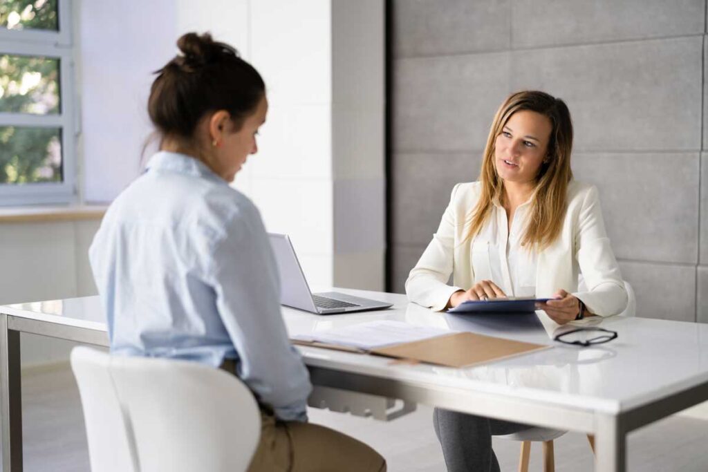 a provider and client talk about the benefits of intensive outpatient treatment